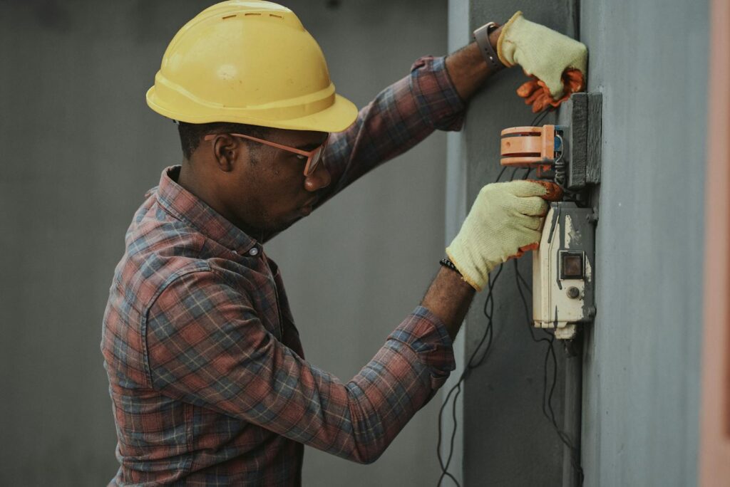 Photo by Emmanuel Ikwuegbu An Electrician Repairing a Fuse Box